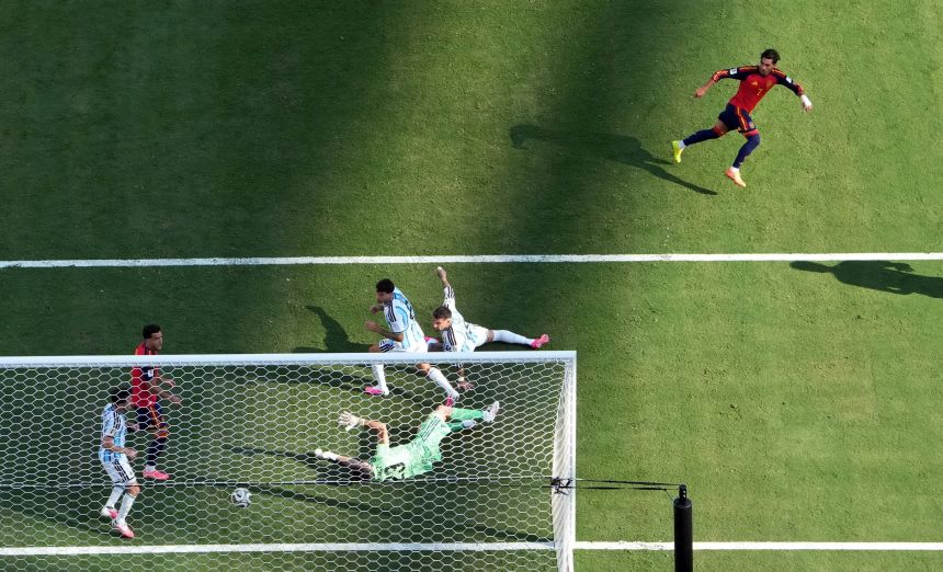 Torres, top right, watches his goal fly past Argentina goalkeeper Emiliano Martínez.