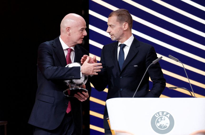 FIFA President Gianni Infantino, left, shakes hands with UEFA President Aleksander Čeferin at the UEFA Congress in Brussels, Belgium, in February.