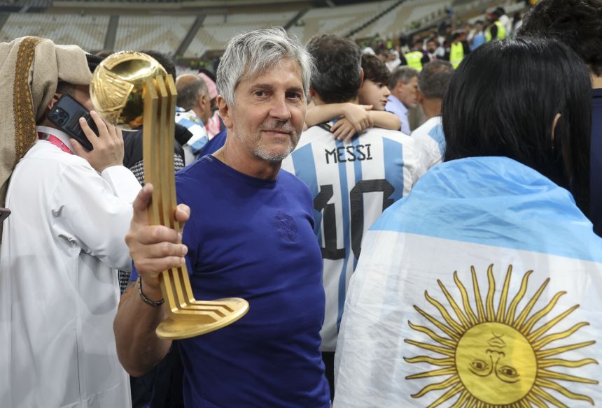Jorge Messi holds his son's World Cup Golden Ball trophy after Argentina's triumph in 2022.