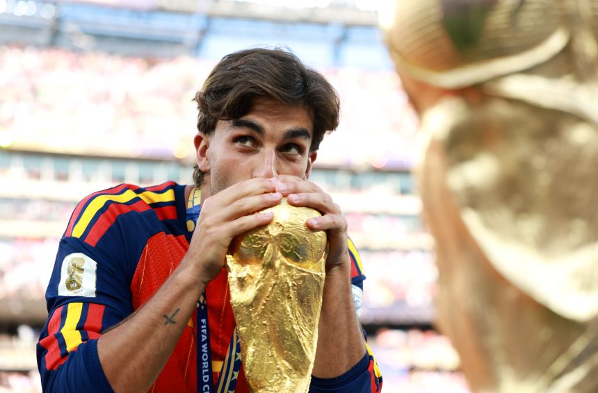 Torres kisses the World Cup trophy after the win against Argentina.
