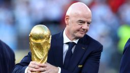 FIFA president Gianni Infantino holds the World Cup trophy after the final between Spain and Argentina on July 19.