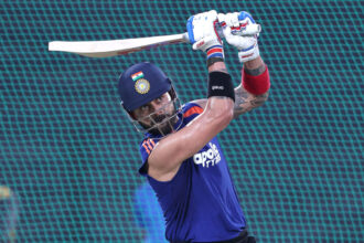 Virat Kohli signs autograph on net bowler's India jersey at Brabourne Stadium